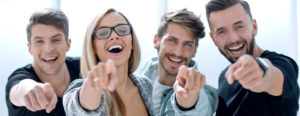 a team of four people standing in the office